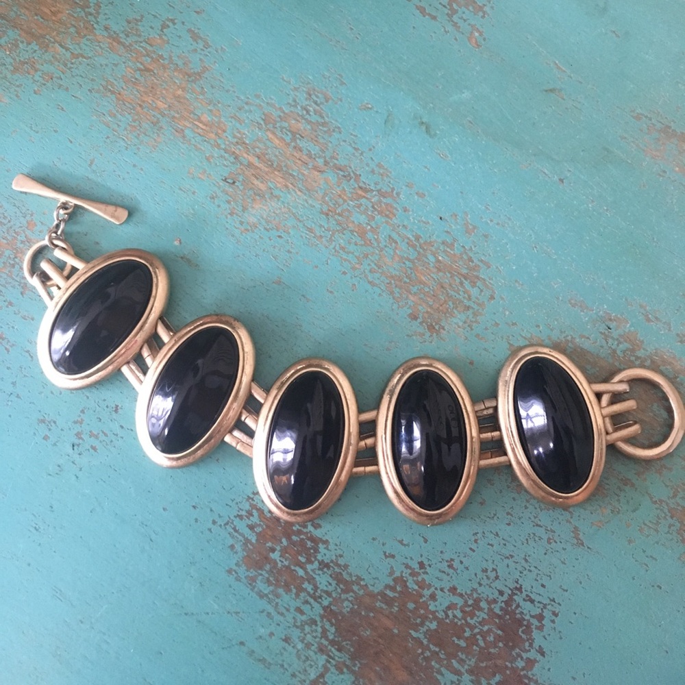 Chunky black and gold bracelet by St. Thomas.